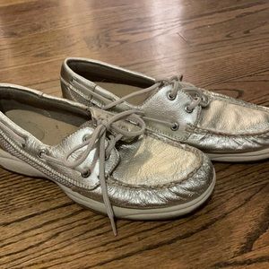 Gold Sperry Top Sider boat shoes.